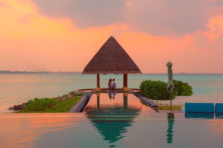 A couple at sunset by the water